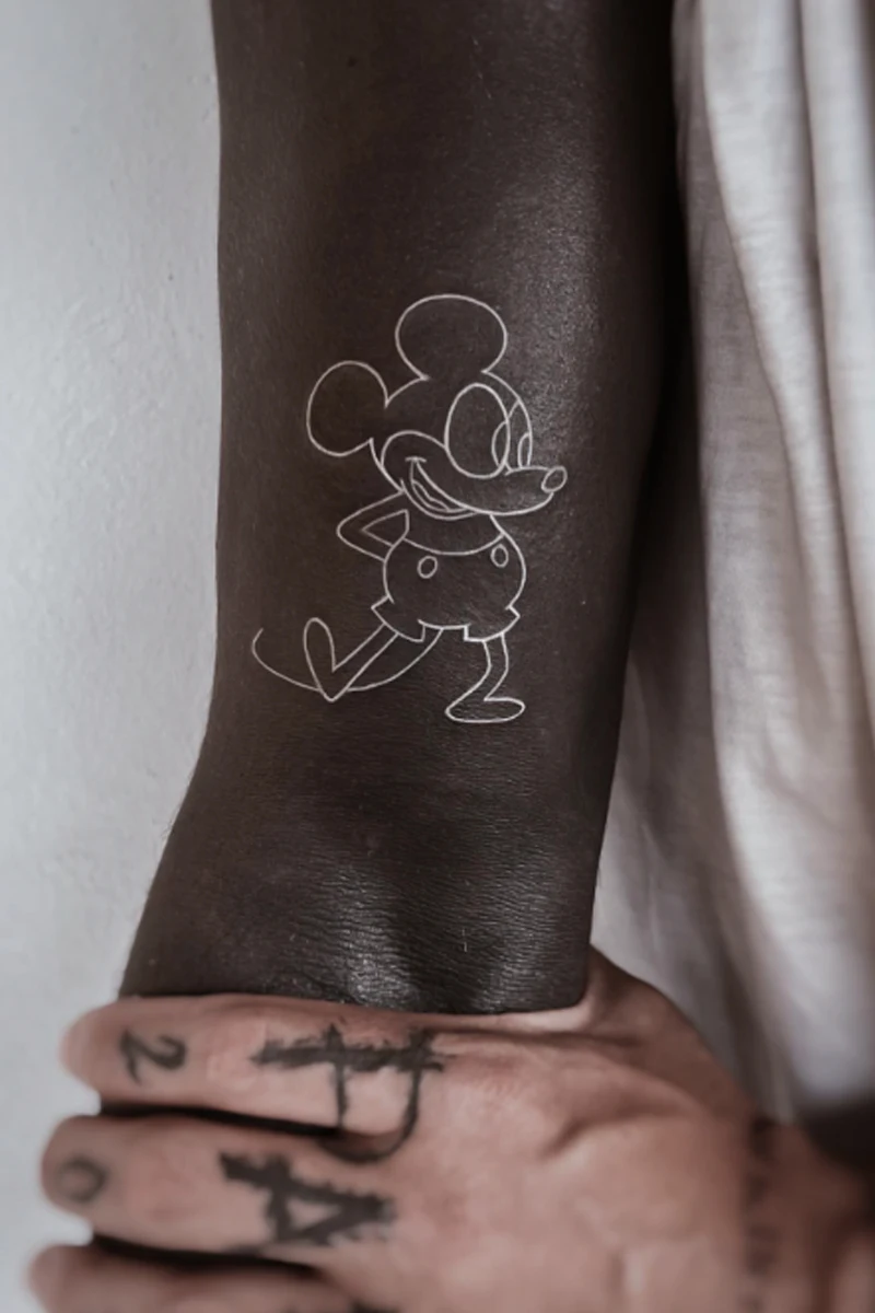 hand with a blackout tattoo