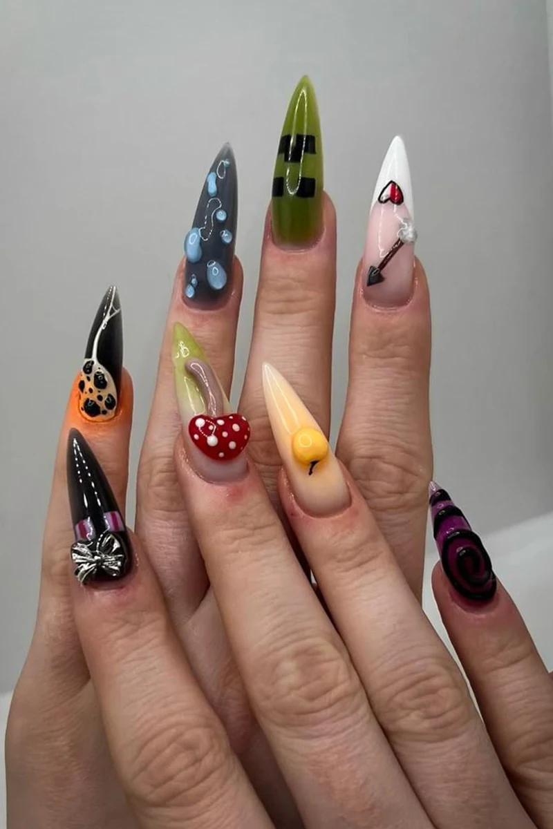 a close-up of woman's nails with minecraft inspired nail look