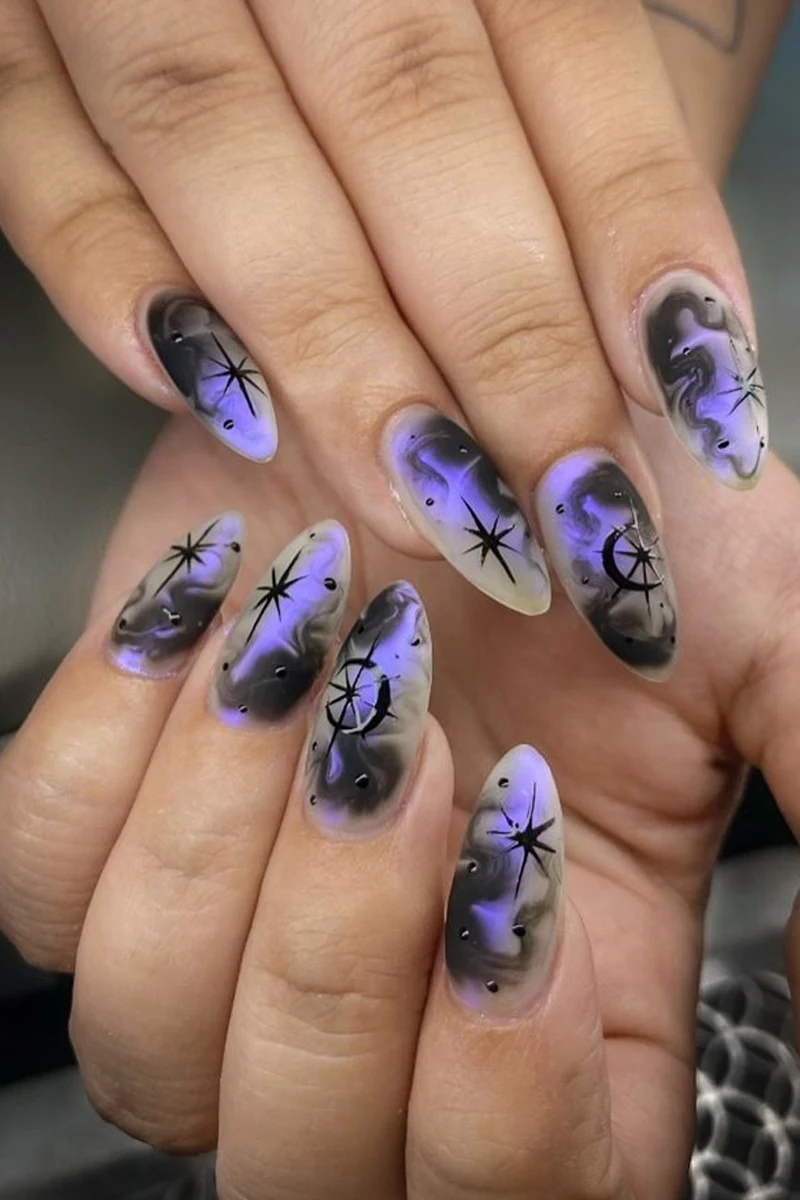 a close-up of woman's nails with minecraft inspired nail look