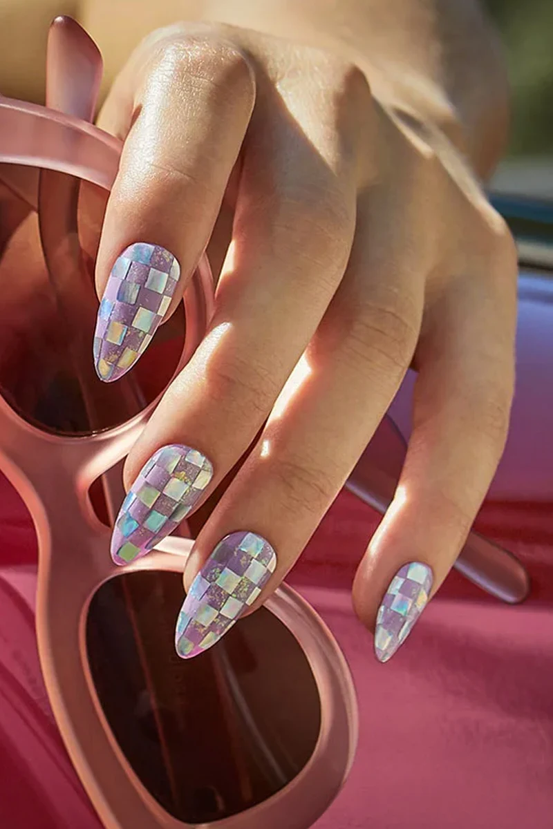 a close-up of woman's nails with minecraft inspired nail look