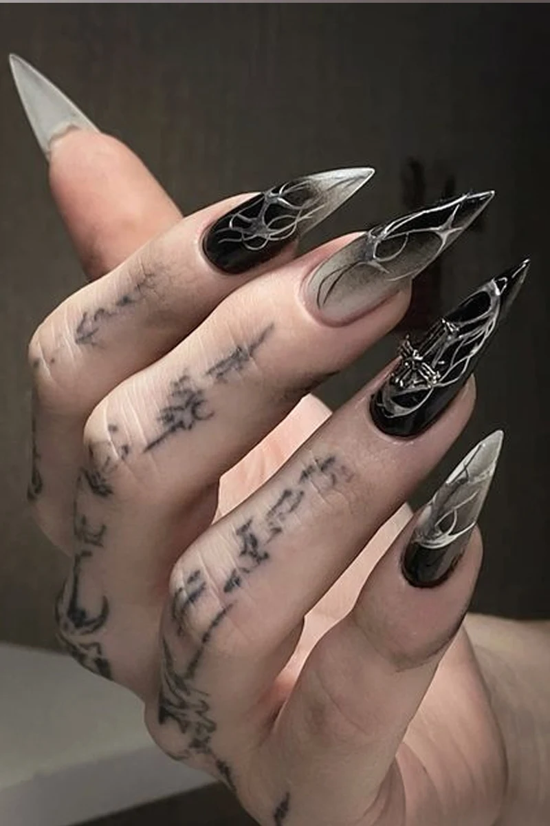 nosferatu-inspired black and white nails that look like claws