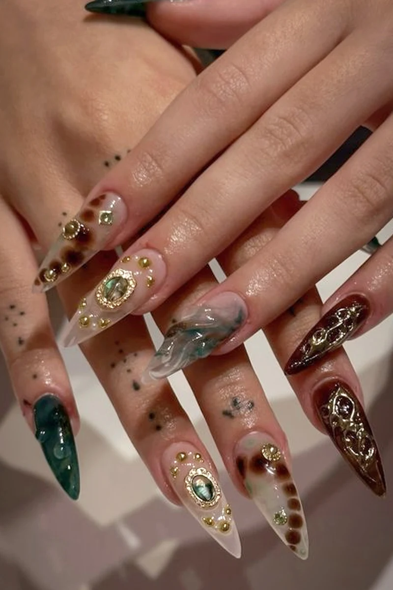 Romani-inspired Nails covered in gems and sparkles