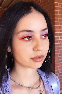Maddy Perez with Neon Orange Eyeliner makeup look from euphoria