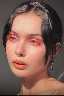 Maddy Perez with Neon Orange Eyeliner makeup look from euphoria