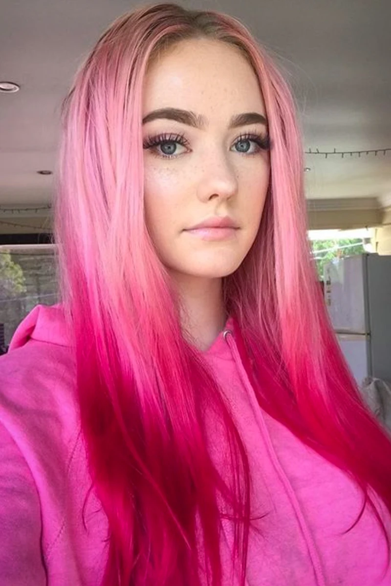 a portrait of a beautiful woman with a hot pink hair